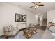 Bright living room with hardwood floors and a view to the staircase at 300 Silver Moon Drive, Loganville, GA 30052