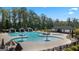 Community pool with spray park and lounge area at 300 Silver Moon Drive, Loganville, GA 30052