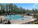 Resort-style pool with multiple areas, cabanas, and lounge chairs at 315 Silver Moon Drive, Loganville, GA 30052