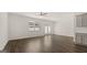 Bright living room featuring hardwood floors and sliding glass doors at 315 Silver Moon Drive, Loganville, GA 30052