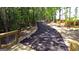 Paved path with wooden bridge and scenic wooded views at 315 Silver Moon Drive, Loganville, GA 30052