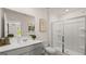 Bathroom with a walk-in shower and gray vanity at 596 Silver Moon Drive, Loganville, GA 30052