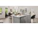 Modern kitchen island with white countertops and gray cabinets at 596 Silver Moon Drive, Loganville, GA 30052