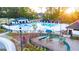 Community pool with playground, cabanas, and grilling station at 596 Silver Moon Drive, Loganville, GA 30052