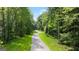 Paved walking trail winding through lush trees at 596 Silver Moon Drive, Loganville, GA 30052