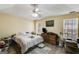 Main bedroom with double windows and ceiling fan at 3153 Sweetbriar Dr, Villa Rica, GA 30180