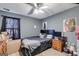 Spacious bedroom with ceiling fan and large bed at 3153 Sweetbriar Dr, Villa Rica, GA 30180