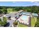 Aerial view of a clubhouse with pool and tennis courts at 3153 Sweetbriar Dr, Villa Rica, GA 30180