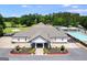 Aerial view of a clubhouse with pool and tennis courts nearby at 3153 Sweetbriar Dr, Villa Rica, GA 30180