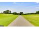 Paved pathway leading through a grassy landscape at 3153 Sweetbriar Dr, Villa Rica, GA 30180