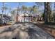 Brick ranch home with attached two-car garage and long driveway at 3153 Sweetbriar Dr, Villa Rica, GA 30180