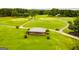 Aerial view of a golf course with gazebo at 3153 Sweetbriar Dr, Villa Rica, GA 30180