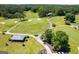 Aerial view of a lush green golf course with fairways and greens at 3153 Sweetbriar Dr, Villa Rica, GA 30180