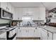 Kitchen with granite countertops and white cabinets at 3153 Sweetbriar Dr, Villa Rica, GA 30180