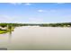 Scenic view of a tranquil lake with houses along the shore at 3153 Sweetbriar Dr, Villa Rica, GA 30180