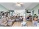 Spacious living room with sectional sofa and hardwood floors at 3153 Sweetbriar Dr, Villa Rica, GA 30180