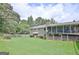 Spacious backyard with a large screened porch at 100 Aspen Way, Fayetteville, GA 30214