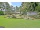 Landscaped backyard with shed and lush greenery at 100 Aspen Way, Fayetteville, GA 30214