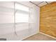 Basement closet with wire shelving and wood paneling at 100 Aspen Way, Fayetteville, GA 30214