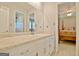 Clean bathroom with white vanity and large mirror at 100 Aspen Way, Fayetteville, GA 30214