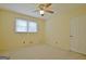 Bright bedroom with double windows and ceiling fan at 100 Aspen Way, Fayetteville, GA 30214