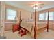 Bedroom with a four-poster bed and wood floors at 100 Aspen Way, Fayetteville, GA 30214