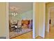 Formal dining room with hardwood floors and chandelier at 100 Aspen Way, Fayetteville, GA 30214