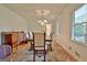 Bright dining room with hardwood floors and large window at 100 Aspen Way, Fayetteville, GA 30214