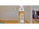 View of a bright dining room with hardwood floors and access to kitchen at 100 Aspen Way, Fayetteville, GA 30214