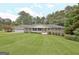 Ranch house with a large front yard and attached garage at 100 Aspen Way, Fayetteville, GA 30214