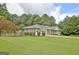 Brick home with a detached garage and large backyard at 100 Aspen Way, Fayetteville, GA 30214