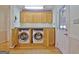 Convenient laundry room with washer and dryer at 100 Aspen Way, Fayetteville, GA 30214