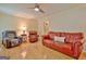 Spacious living room with hardwood floors and leather sofas at 100 Aspen Way, Fayetteville, GA 30214