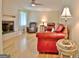 Living room with fireplace and leather furniture at 100 Aspen Way, Fayetteville, GA 30214