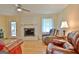 Living room with fireplace and leather furniture at 100 Aspen Way, Fayetteville, GA 30214