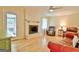 Living room with fireplace, hardwood floors, and door to patio at 100 Aspen Way, Fayetteville, GA 30214