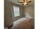 Bedroom with carpet flooring and ceiling fan at 235 Long Dr, Mcdonough, GA 30253