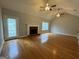 Bright living room featuring hardwood floors and a fireplace at 235 Long Dr, Mcdonough, GA 30253