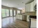 Modern kitchen with white cabinets and stainless steel appliances at 1240 Falls Creek Ct, Conyers, GA 30094