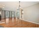 Dining room with hardwood floors, chandelier, and access to deck at 7377 Asbury Dr, Lithonia, GA 30058