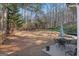 Expansive backyard featuring patio with outdoor dining set and wooded views at 3700 Mays Sw Xing, Atlanta, GA 30331