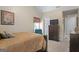Bedroom featuring a plush bed, adjacent seating, and matching dresser at 3700 Mays Sw Xing, Atlanta, GA 30331