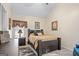 Comfortable bedroom features vaulted ceiling, window, and wood-toned furnishings at 3700 Mays Sw Xing, Atlanta, GA 30331
