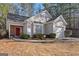 Charming single Gathering home with a red front door, mature landscaping, and an attached garage at 3700 Mays Sw Xing, Atlanta, GA 30331