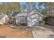 Charming single Gathering home with attached garage, mature landscaping, and a concrete walkway at 3700 Mays Sw Xing, Atlanta, GA 30331