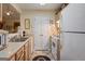 Functional kitchen featuring ample counter space, white appliances, and plenty of storage at 3700 Mays Sw Xing, Atlanta, GA 30331