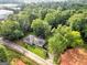 Aerial view of a house with a large backyard and surrounding trees at 4995 Reservoir Dr, Douglasville, GA 30135