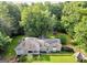 Aerial view of house and yard with surrounding trees at 4995 Reservoir Dr, Douglasville, GA 30135