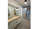 Bathroom with concrete vanity, walk-in shower, and modern fixtures at 165 Kelmscott Ln., Fayetteville, GA 30214