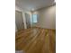 Light-filled bedroom with hardwood floors and two closets at 165 Kelmscott Ln., Fayetteville, GA 30214